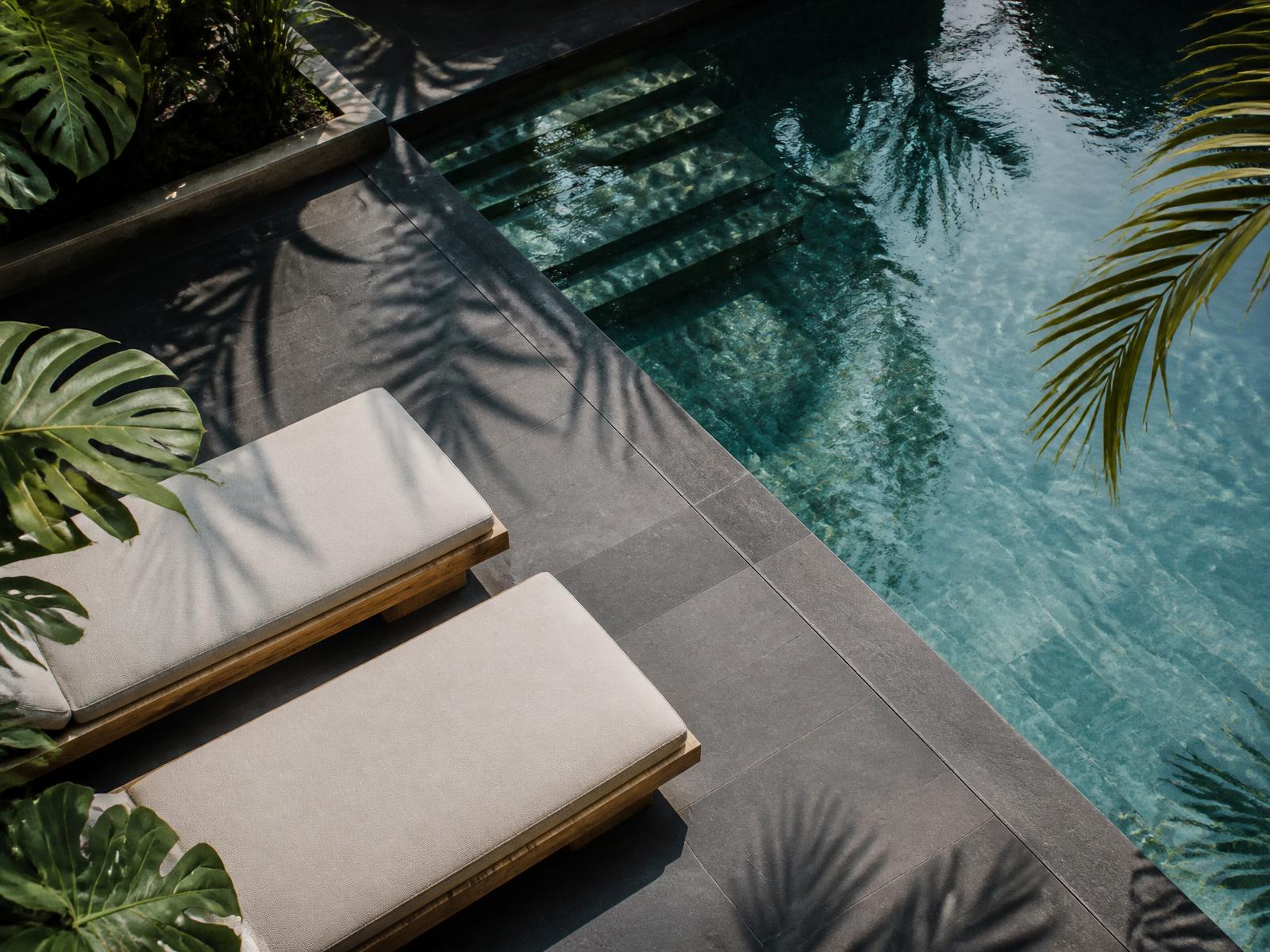 Clean modern pool deck with still water